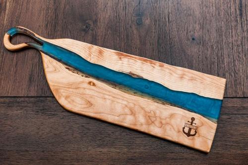 Quilted Maple Charcuterie with a blend of blue epoxies 