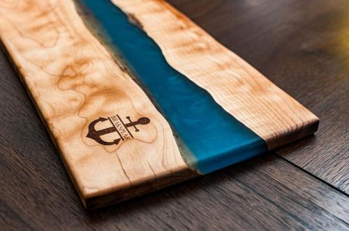 Quilted Maple Charcuterie with a blend of blue epoxies 