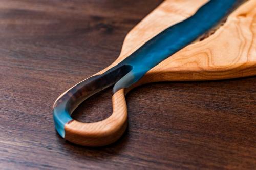 Quilted Maple Charcuterie with a blend of blue epoxies 