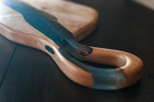 Quilted Maple Charcuterie with a blend of blue epoxies 